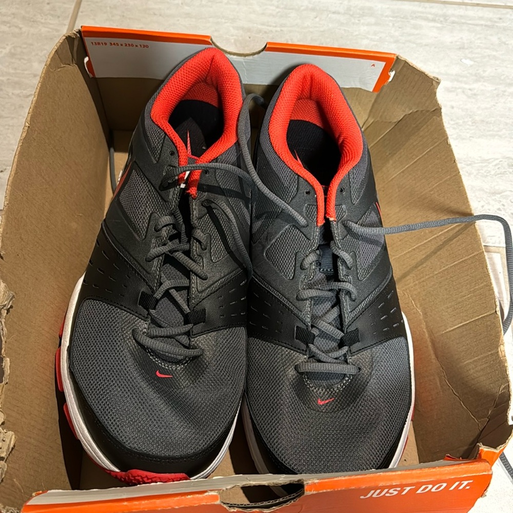 Gray Nike Air Max with red and black trim